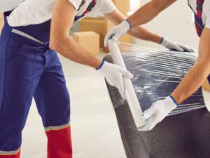 How do movers pack furniture in the truck before moving it?